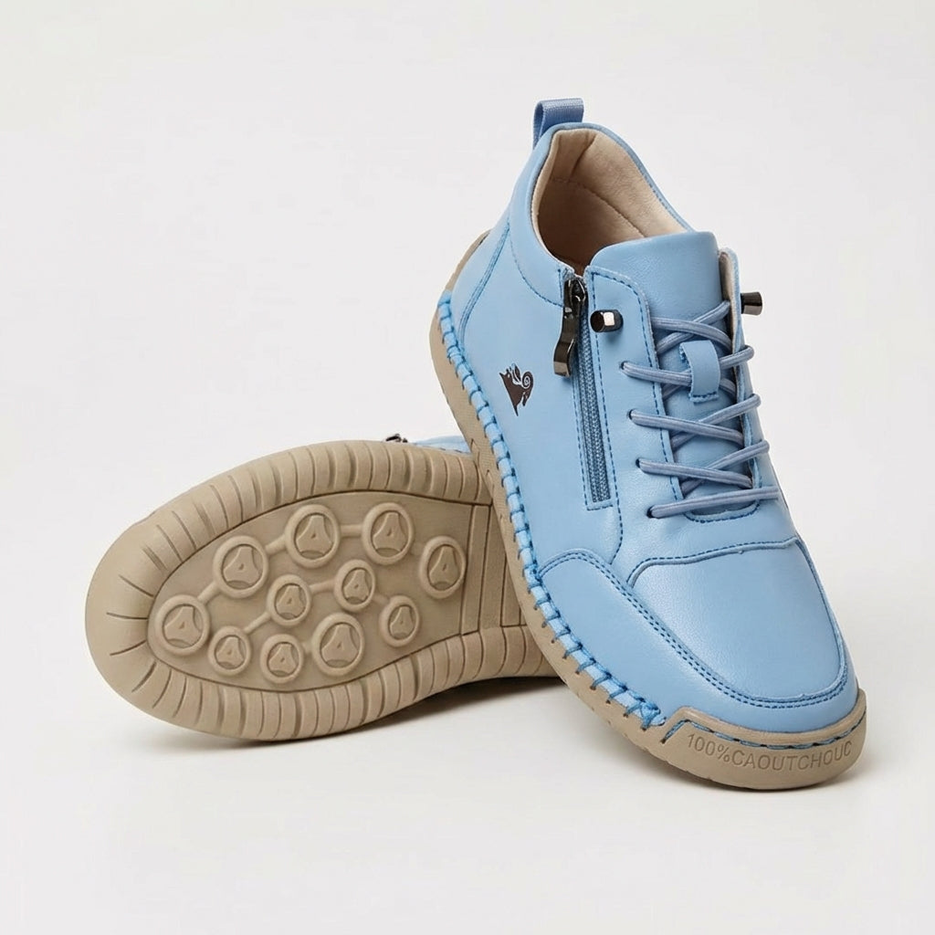 Light blue side-zip lace-up sneakers with side zipper and tan textured outsole