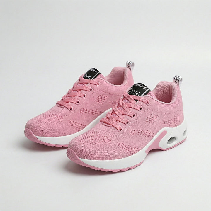Pink knit walking sneakers with air-cushion sole, lace-up design.