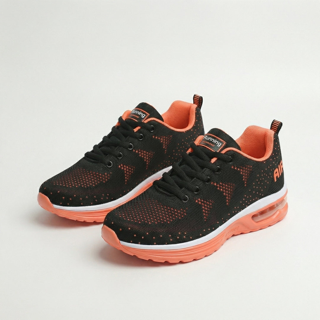 Black womens cushioned walking sneakers with orange lining and air sole, lace-up