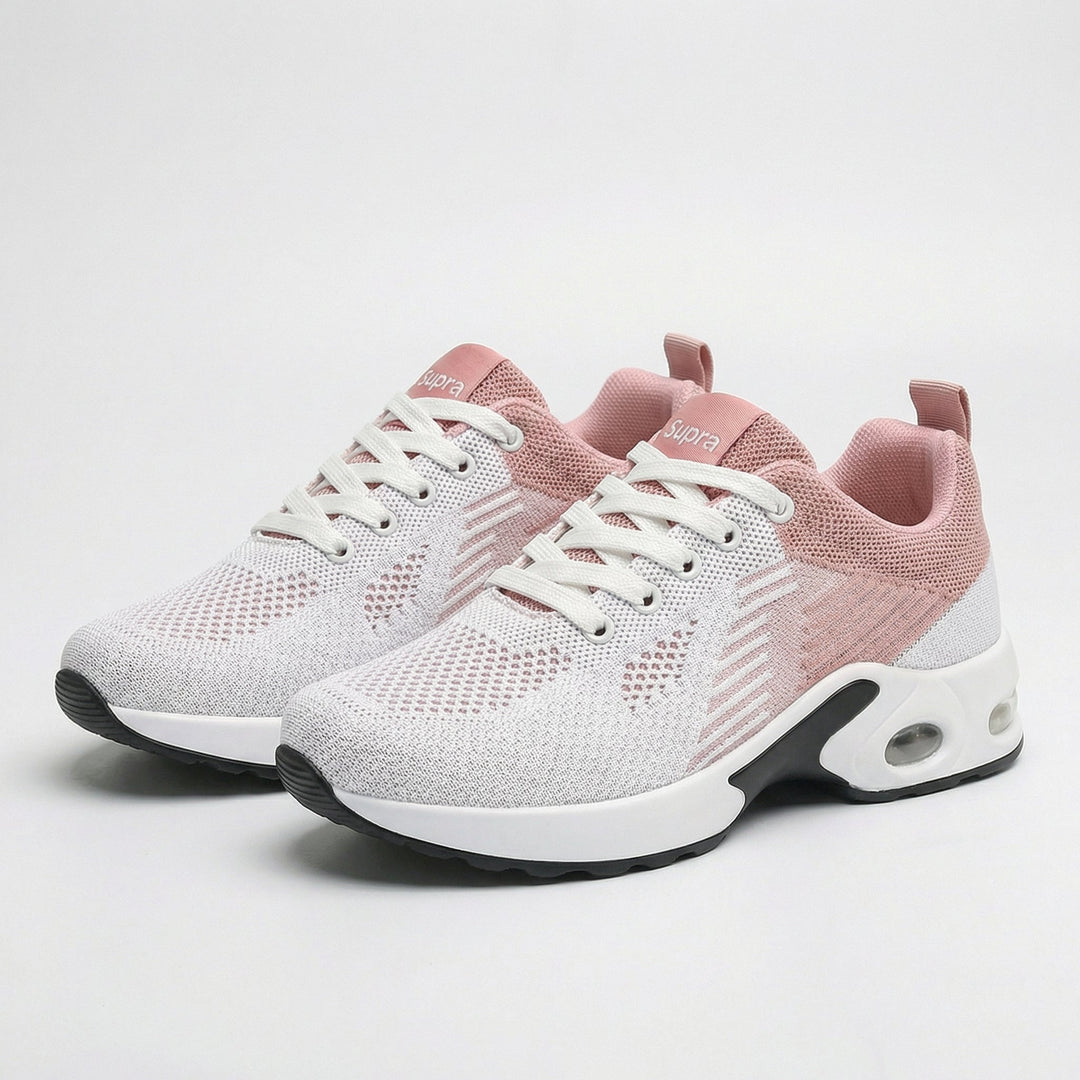 Light pink lightweight walking sneakers with white laces and cushioned sole