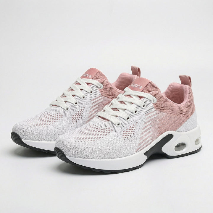 Light pink lightweight walking sneakers with white laces and cushioned sole