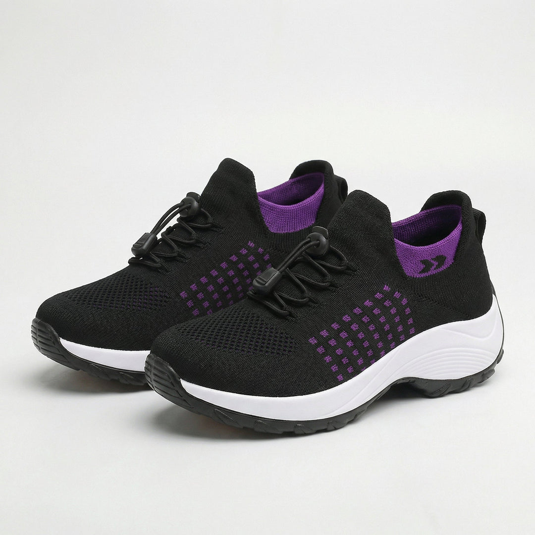 Women’s black walking sneakers with purple accents, lace-up, cushioned white sole