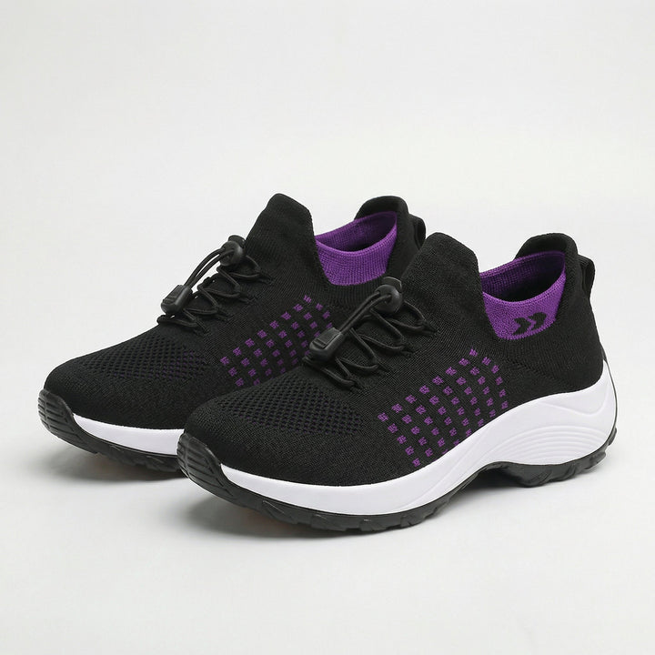 Women’s black walking sneakers with purple accents, lace-up, cushioned white sole