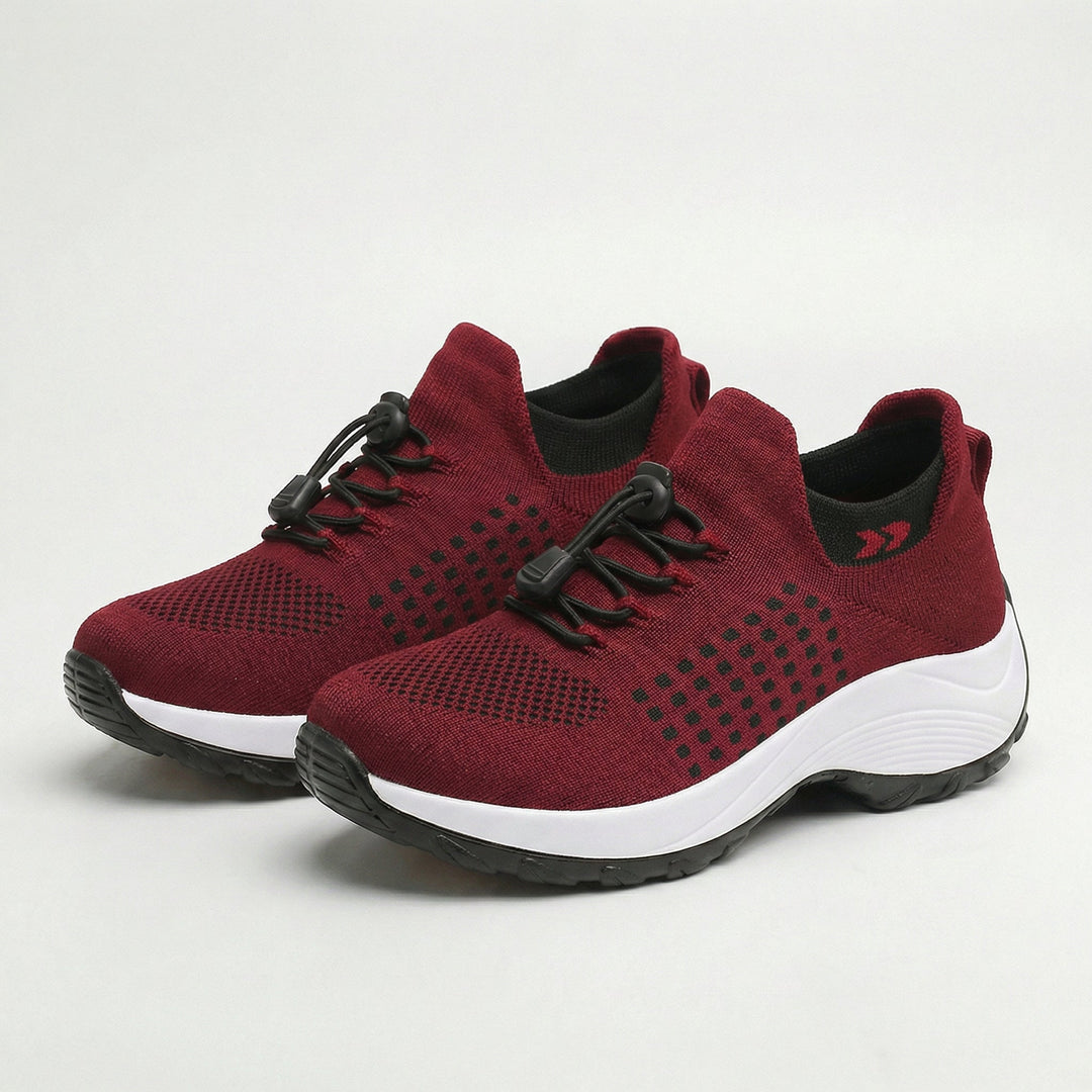 Burgundy unisex walking sneakers with black laces and white shock-absorbing sole