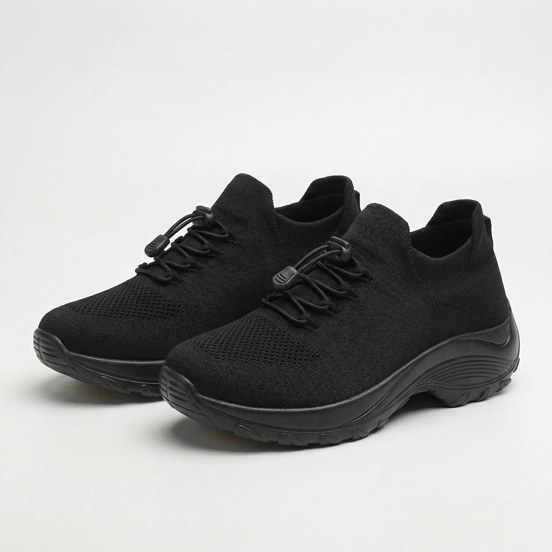 Black knit walking sneakers with lace-up front and cushioned chunky sole