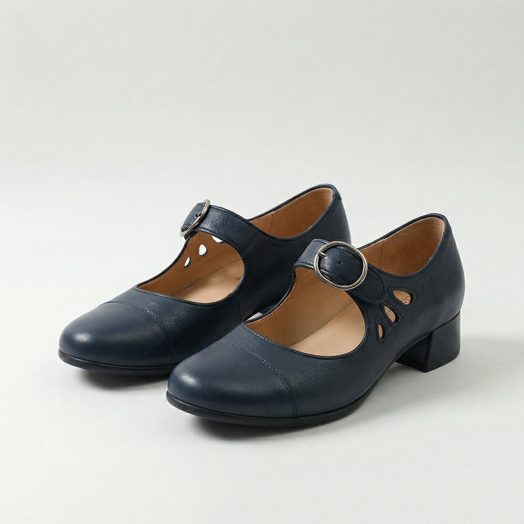 Dark leather low-heel Mary Jane shoes with buckle strap and cutout detail
