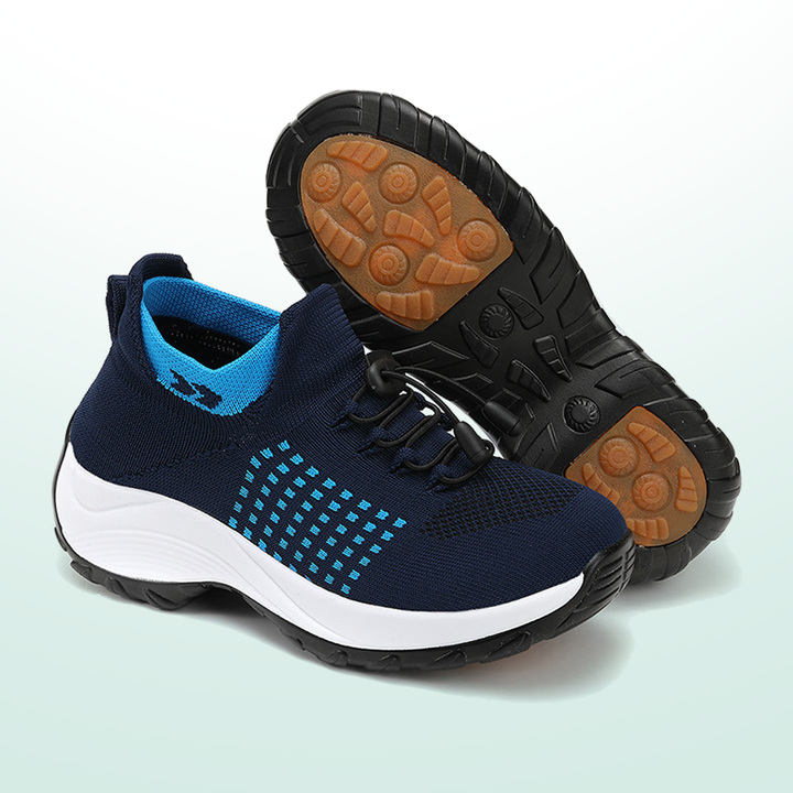 Navy lace-up walking sneakers with blue accents and rubber outsole tread detail