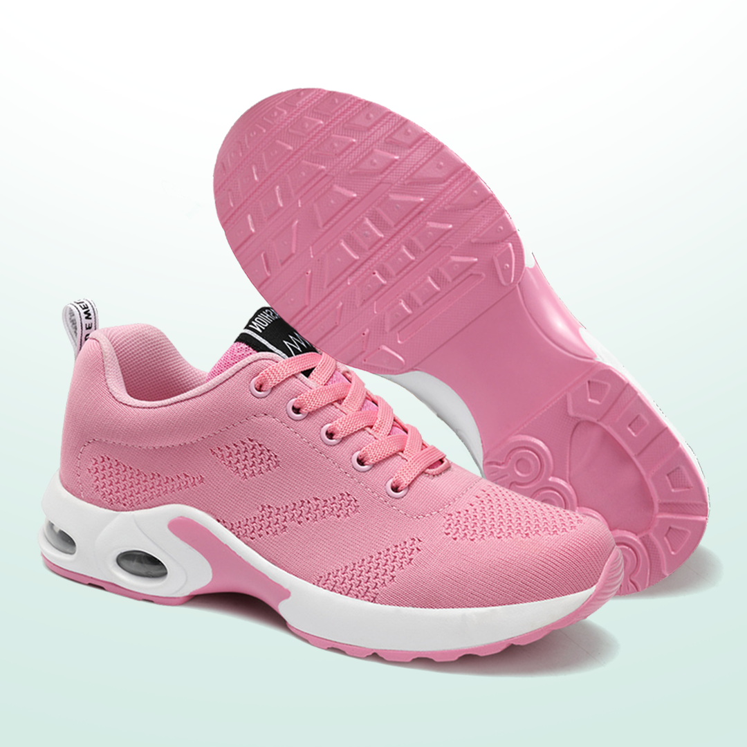 Pink knit lace-up sneakers with cushioned sole and treaded outsole view.
