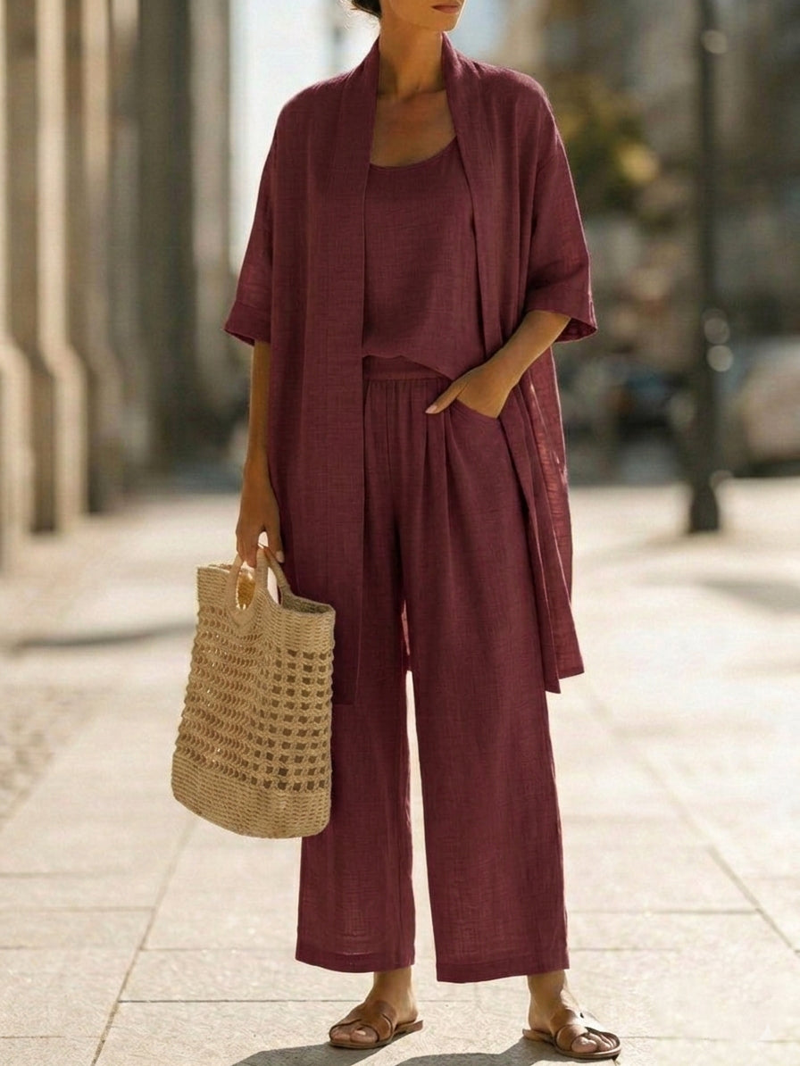 Women’s lounge set in wine red: short cardigan layered over camisole and loose wide-leg pants.