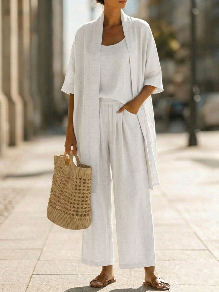 White 3-piece lounge set with scoop-neck top, wide-leg pants, and short-sleeve open cardigan