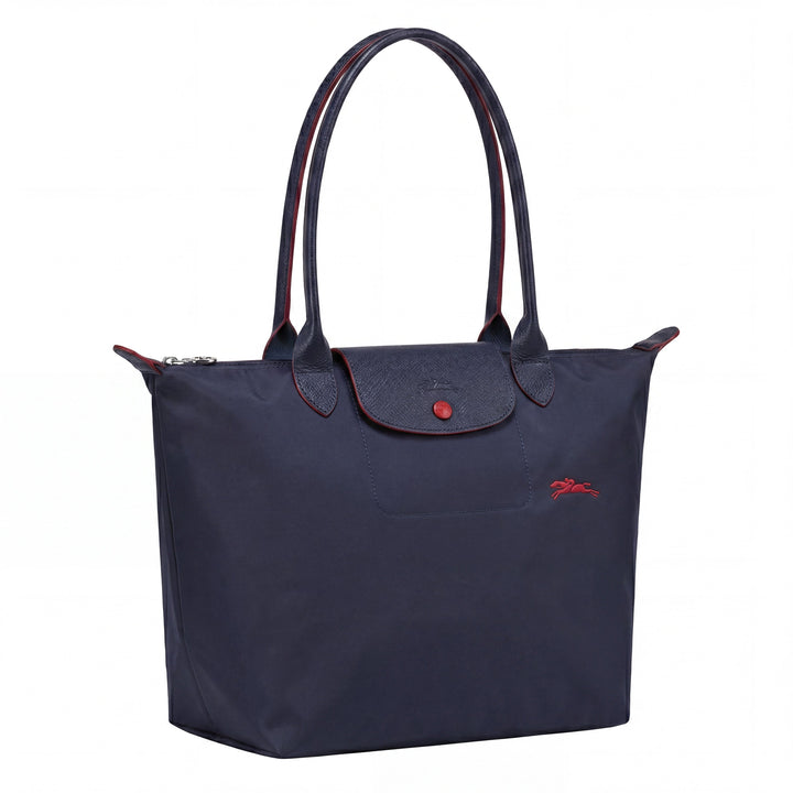 Navy tote bag with top handles, front flap with snap button, small red logo