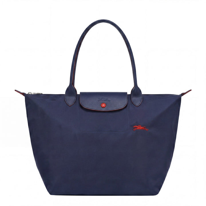 Dark blue tote bag with front flap pocket, snap button, and red logo