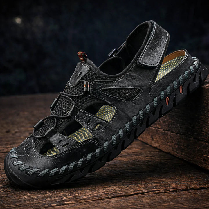 Rugged black sandals with hook-and-loop straps and cushioned sole