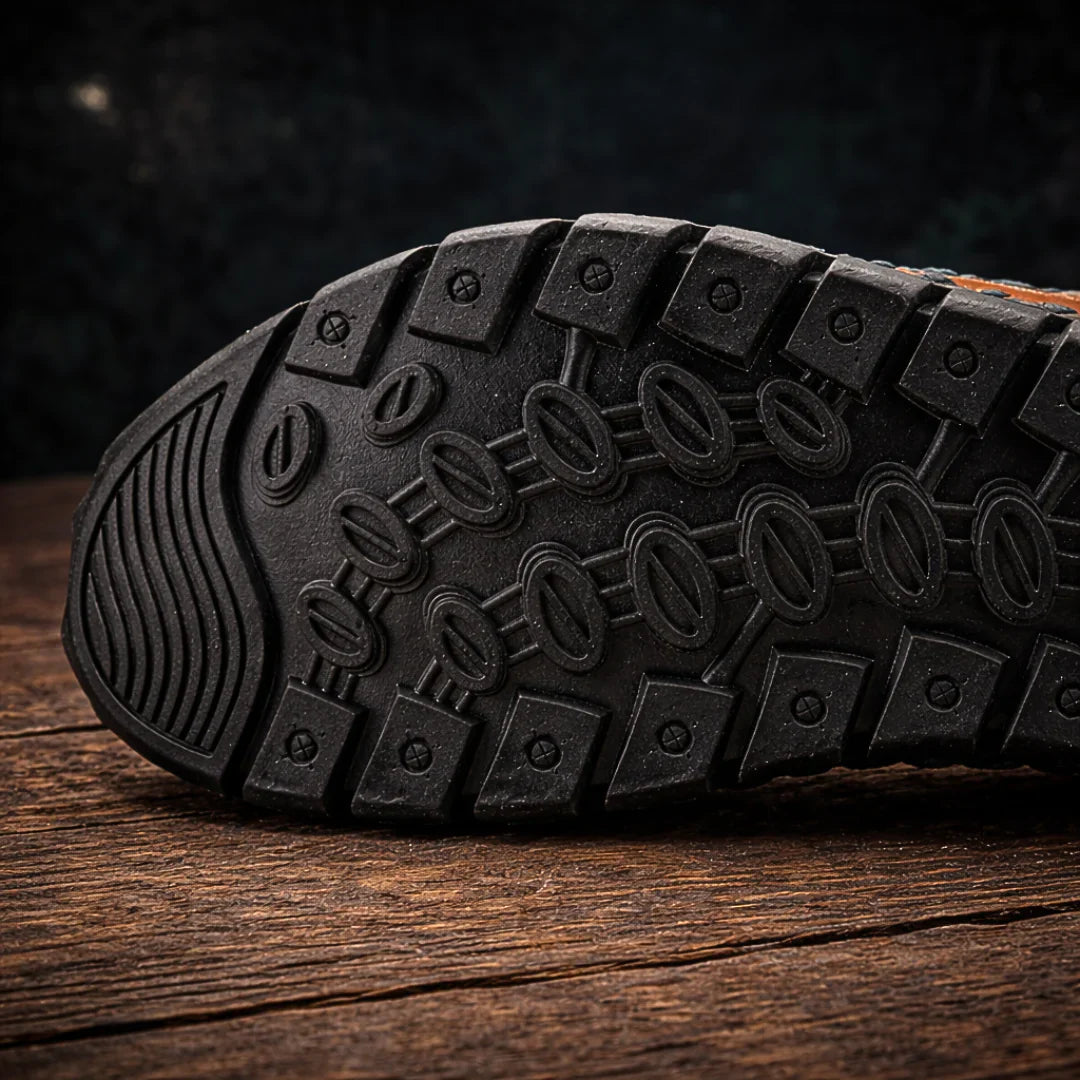 Black sandal outsole tread with deep traction lugs