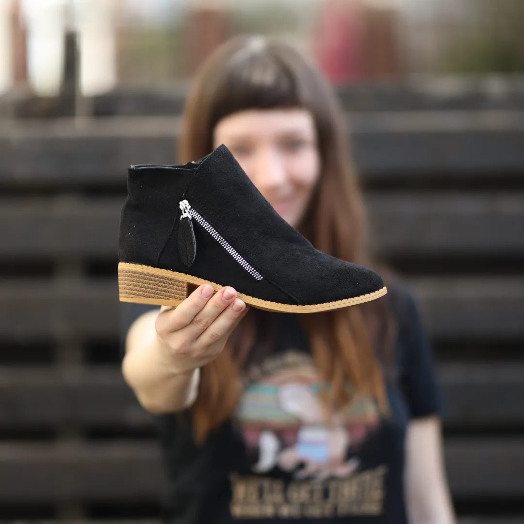 Black suede ankle boot with side zipper and wood-look block heel