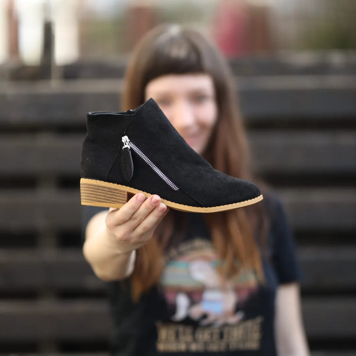 Black suede ankle boot with side zipper and wood-look block heel