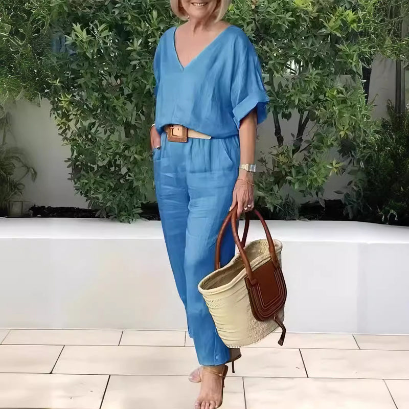 Light blue V-neck two-piece set with draped sleeves and matching ankle-length pants