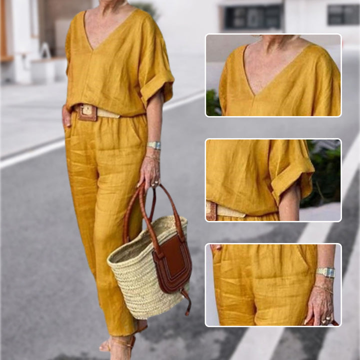 Yellow V-neck two-piece set detail view: draped sleeves, fitted waist, matching pants