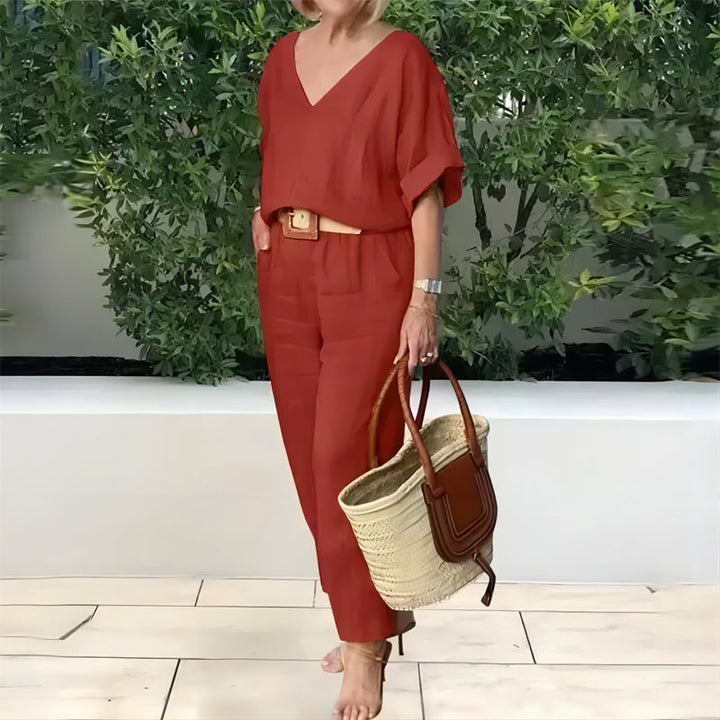 Burgundy red V-neck two-piece set with draped sleeves and matching ankle-length pants